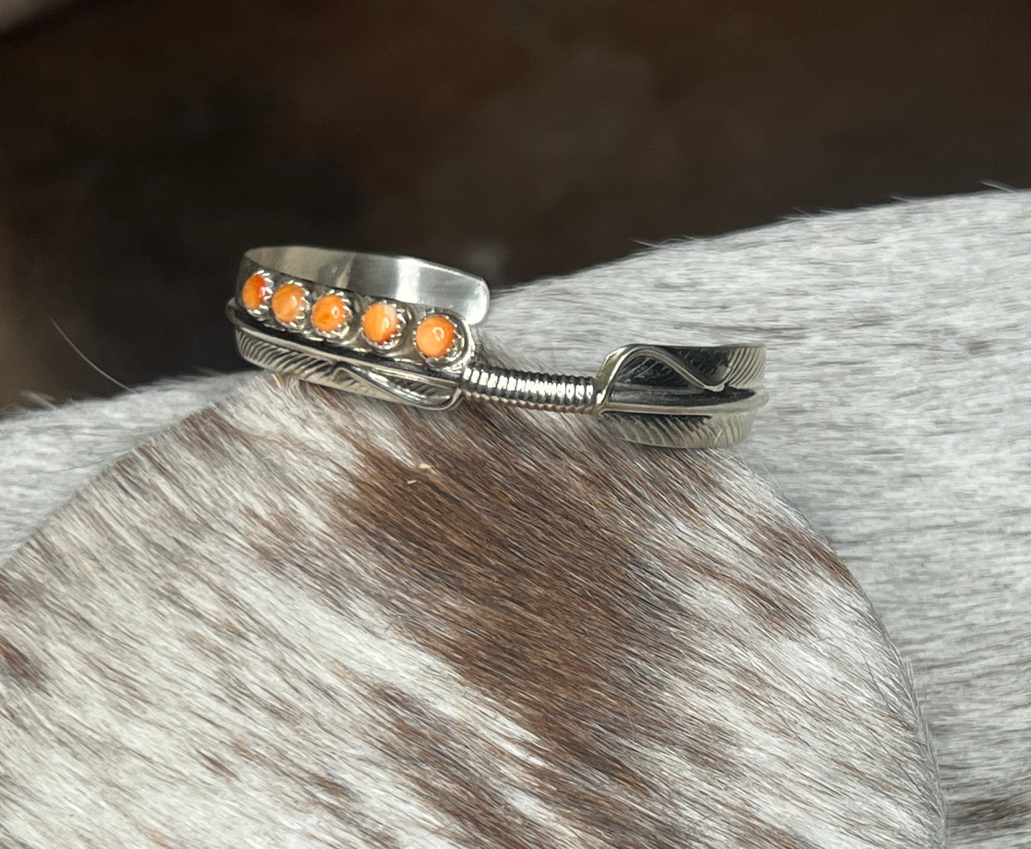 5 Stone Orange Spiny Feather Cuff