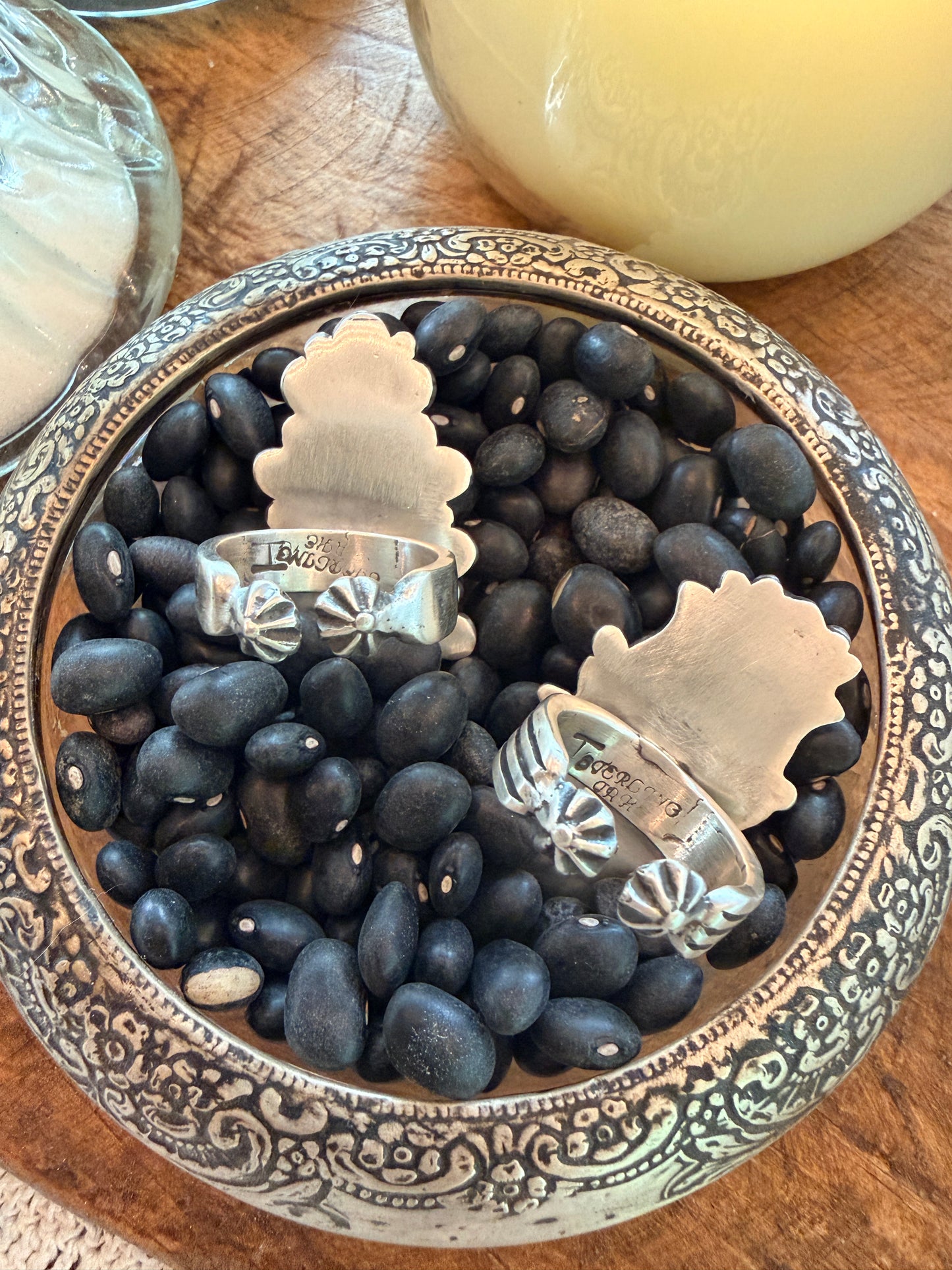 Handcrafted Native American sterling silver ring, featuring a intricate concho-style design with dimensional silver details