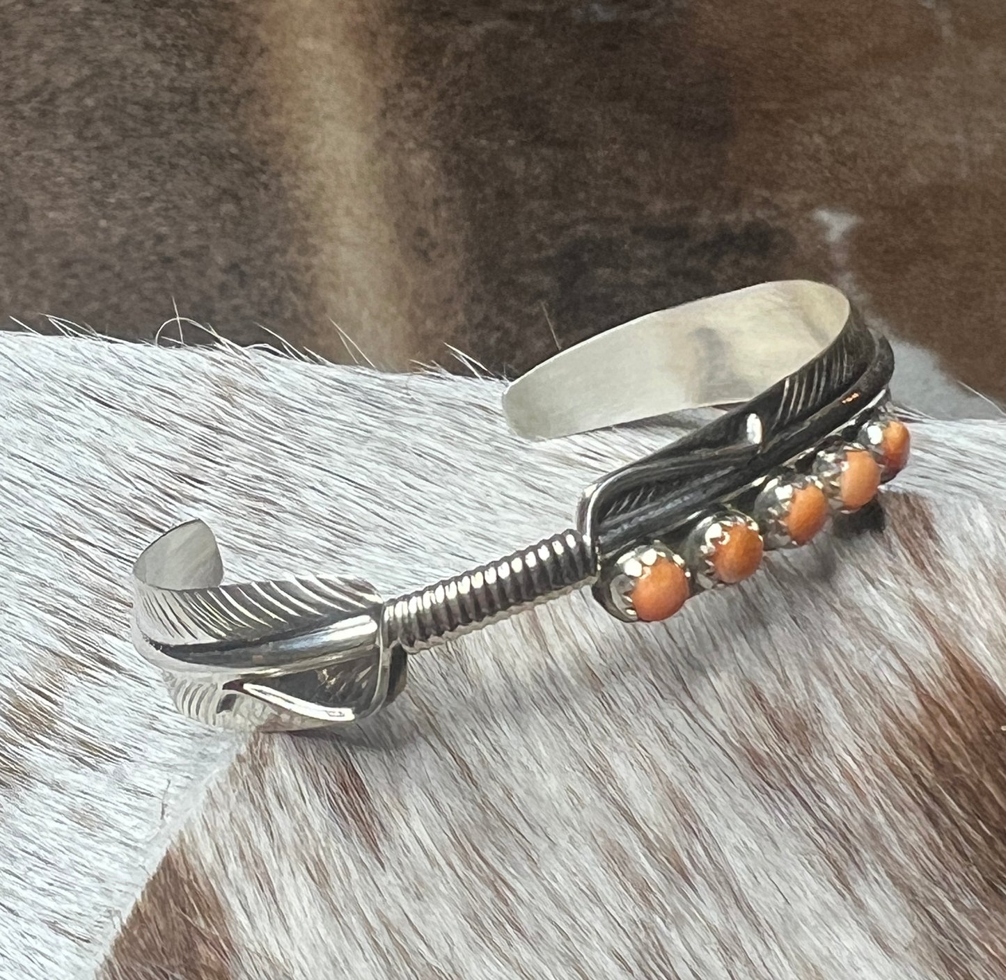 5 Stone Orange Spiny Feather Cuff